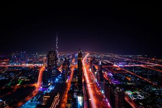 Aircraft above a Gulf city skyline, representing Middle East airline pilot recruitment